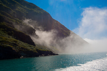 Heavy mist with island in the fjord of Narsarsuaq, Greenland