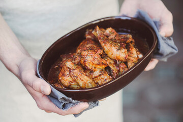 Shkmeruli, is a traditional Georgian dish of chicken in garlic sauce. Almaty, Kazakhstan.