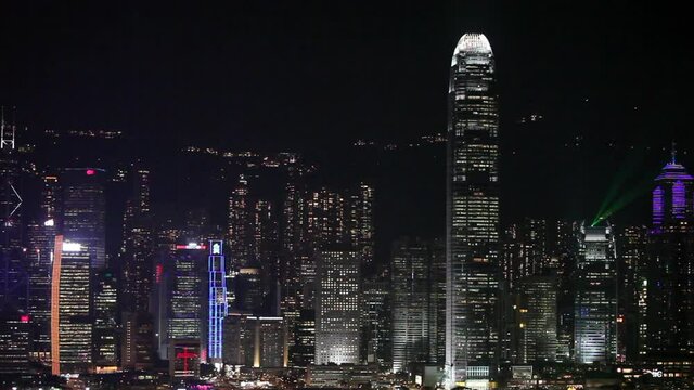 Victoria Harbour with the skyscrapers from Hong Kong Island illuminating the night.