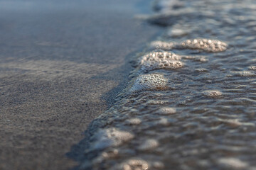 ocean wave washing on shore detail