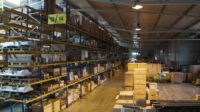 Warehouse area 13 and 14 with packed boxes stacked in shelves,aerial.