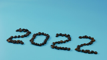 idea and creative number 2022, coffee beans on a blue background