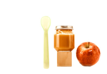 baby food in a jar isolate. baby puree in a transparent glass jar on a white background. fruit baby puree with spoon