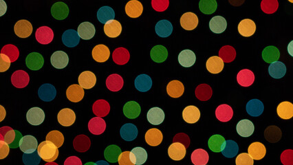 Color photo of blurred Christmas lights at night