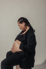 Fototapeta premium Black Pregnant Model with Cornrows
