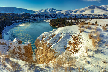 Obraz premium The Flathead River after a fresh snowfall in the Mission Valley, Montana, USA