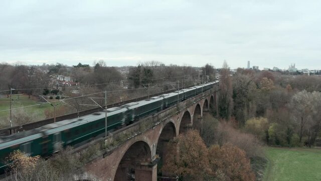 Stationary aerial shot of Great western railway javelin high speed train over Wharncliffe viaduct London