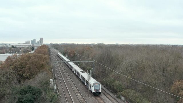 Rising Establishing Drone Shot Of TfL Crossrail Train