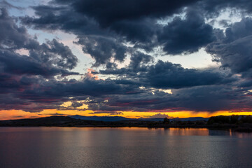 Fototapeta premium Sunset clouds over Pablo National Wildlife Refuge near Polson, Montana, USA