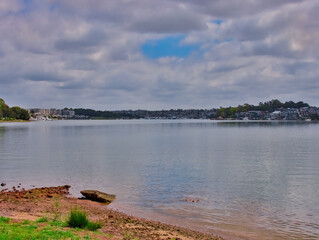 Panorama view of Concord Bay on Sydney Harbour NSW Australia, wealthy houses on the forshore nestled between lush green trees
