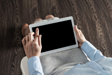 business woman with tablet on her lap