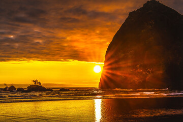 Colorful sunset, Haystack Rock sea stacks, Canon Beach, Clatsop County, Oregon. Originally...