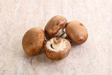 Raw brown champignons mushroom heap