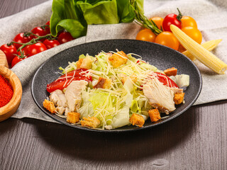 Caesar salad with chicken and cheese