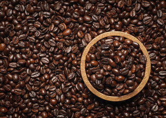 top view, Roasted coffee beans in bowl  for background.
