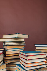 stacks of educational books for training in the college library as a background