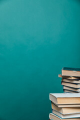 stacks of educational books for training in the college library as a background