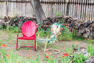Castroville, Texas, USA. Metal chairs in a yard in the Texas Hill Country. (Editorial Use Only)