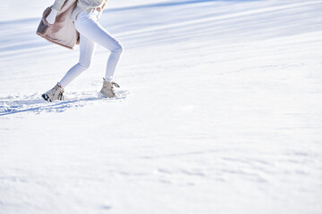 Woman walk on snow during winter season