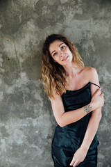 portrait of a beautiful blonde woman in a light summer dress