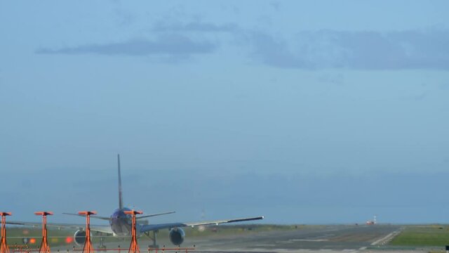 Aircraft Rolling on the Runway and Taking Off, Behind Static Long Shot