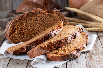 Freshly baked rye bread on wooden board. Homemade sourdough bread.