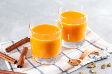 Vegetable milk from pumpkin seeds in a glass on a light background