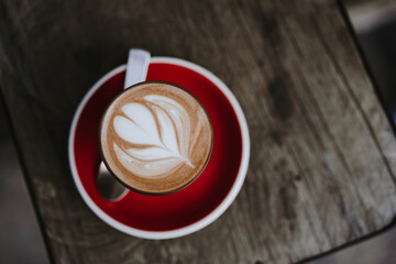 cup of coffee on wooden background