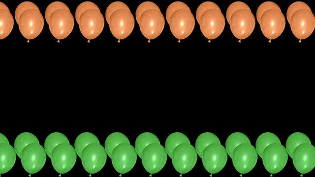 Green and orange colour Bloons in waving motion isolated on black background. Clip for indian government holidays.