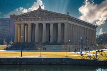 a full-scale replica of the original Parthenon in Athens with tall stone pillars around the...