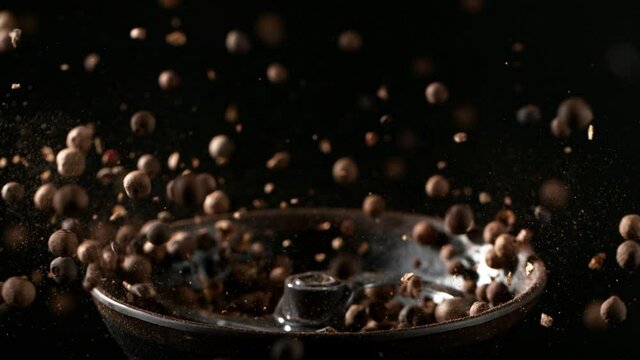 Super slow motion of crushing allspice balls in grinder. Filmed on high speed cinema camera, 1000 fps. Speed ramp effect.