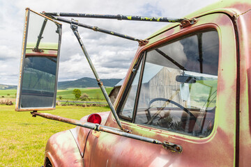 Latah, Washington State, USA. Rear view mirror on an old farm truck. (Editorial Use Only)