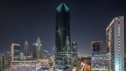 Dubai International Financial district aerial all night timelapse. Panoramic view of business and financial office towers.