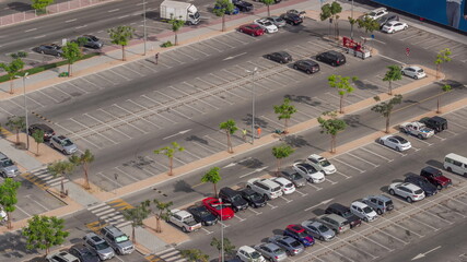 Top view busy parking lot with many cars moving in and out timelapse. © HyperlapsePro