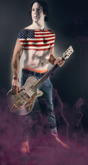 Fototapeta premium Guitarist with USA body painting standing in dust