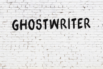 White wall with black paint inscription ghostwriter on it - obrazy, fototapety, plakaty
