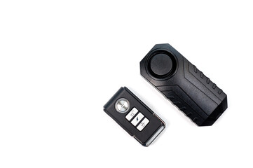 Compact remote control and anti-theft alarm for motorcycle or bicycle.