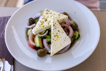 Greek salad with feta cheese. Typical delicious greek style lunch