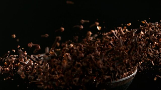 Super slow motion of crushing clove seeds in grinder. Filmed on high speed cinema camera, 1000 fps.