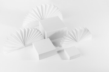 White abstract stage with set of three square white podiums mockup on table for showing,...