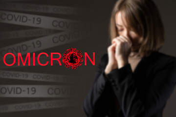 Disease and death from coronavirus. Omicron inscription on the background of a praying woman. A new...