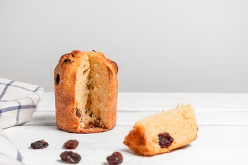 Panettone, traditional italian christmas cake on white wooden table with copy space