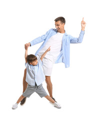Dancing man and his little son on white background