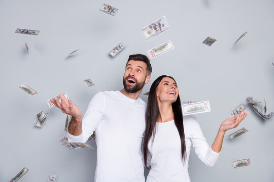 Photo of hooray millennial brunet couple look money wear white shirt isolated on grey background