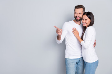 Photo of lovely millennial brunet couple index promo wear white shirt jeans isolated on grey...