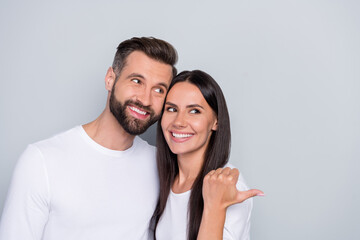 Photo of impressed millennial couple look promo wear white shirt isolated on grey color background