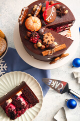 Composition with tasty Christmas chocolate cake on light background