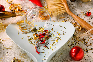 Cleaning of after party mess on grunge background. Christmas celebration