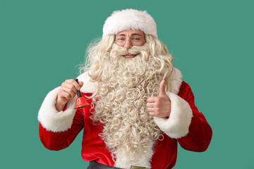 Santa Claus with Christmas bell on green background