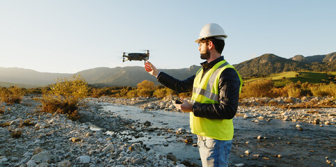 geologist with drone checks the territory